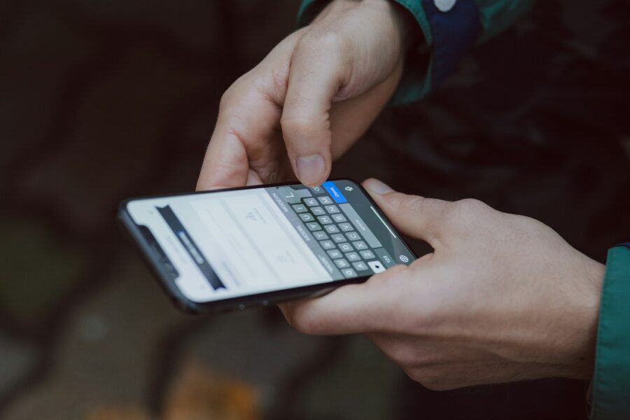 Customer reading an SMS order notification on their smartphone