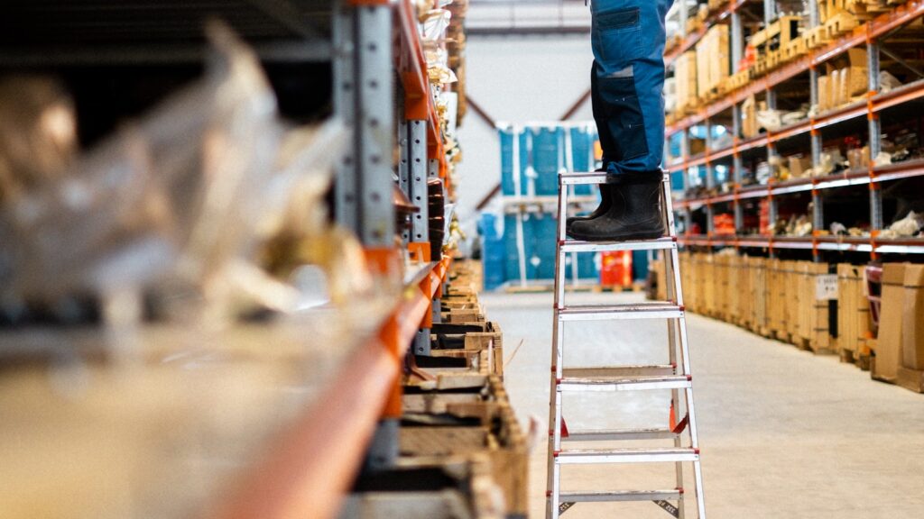 Warehouse worker checking stock that syncs between the ERP and the online store