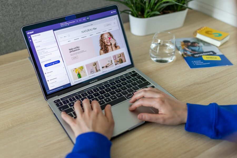 Store manager working in the WooCommerce admin on a laptop