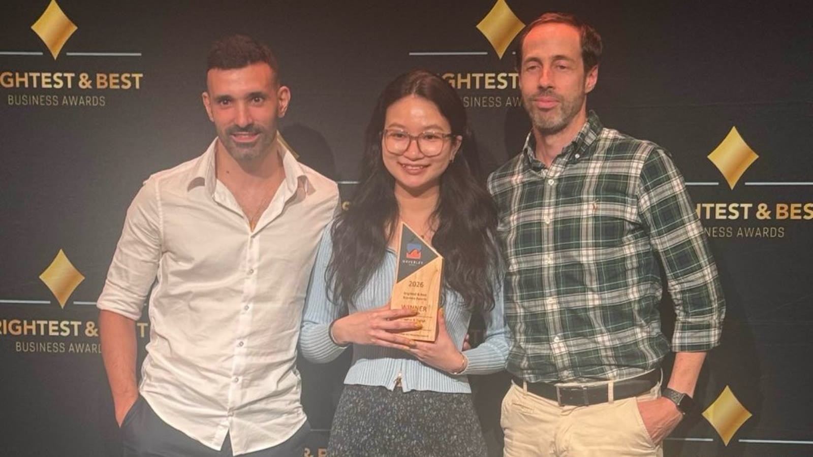 The EUX Digital team holding the 2026 Brightest & Best Business Awards Creative & Digital winner trophy